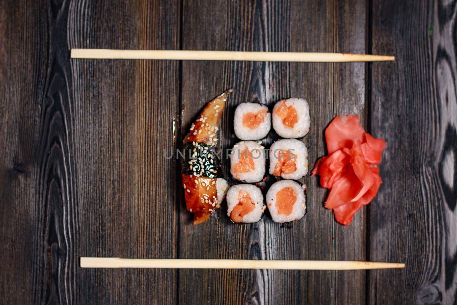 set of sushi and rolls wooden sticks top view ginger wasabi by SHOTPRIME
