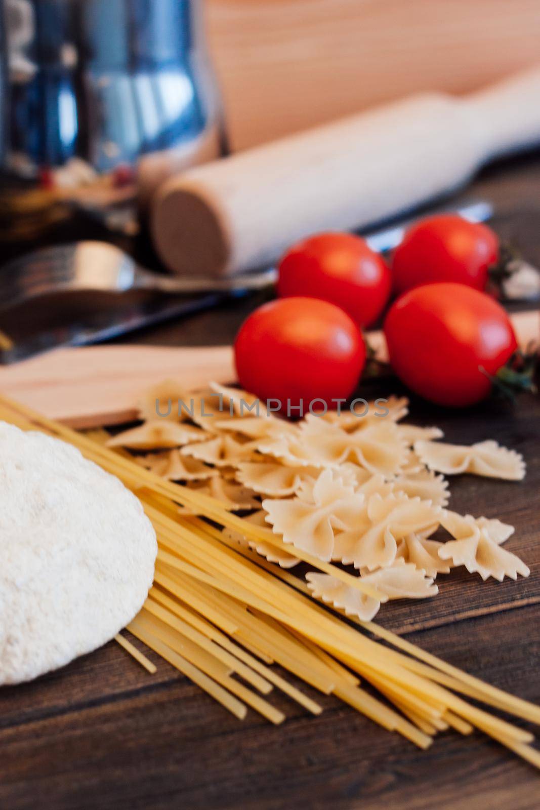 italian cuisine pasta cooking wood table lunch cherry tomatoes by SHOTPRIME