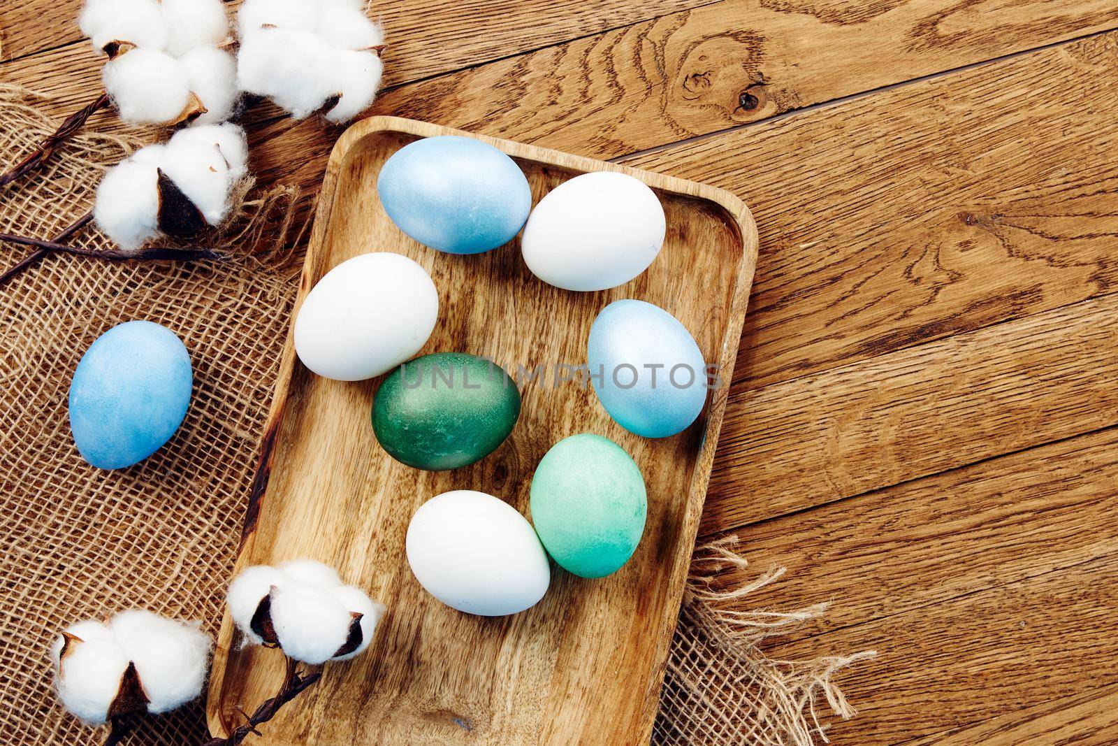 painted eggs decoration verbena wooden background top view. High quality photo