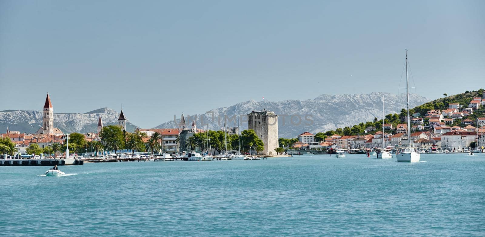 Seaview of Trogir, Croatia, cityscape from level of water, tower, boats and yachts