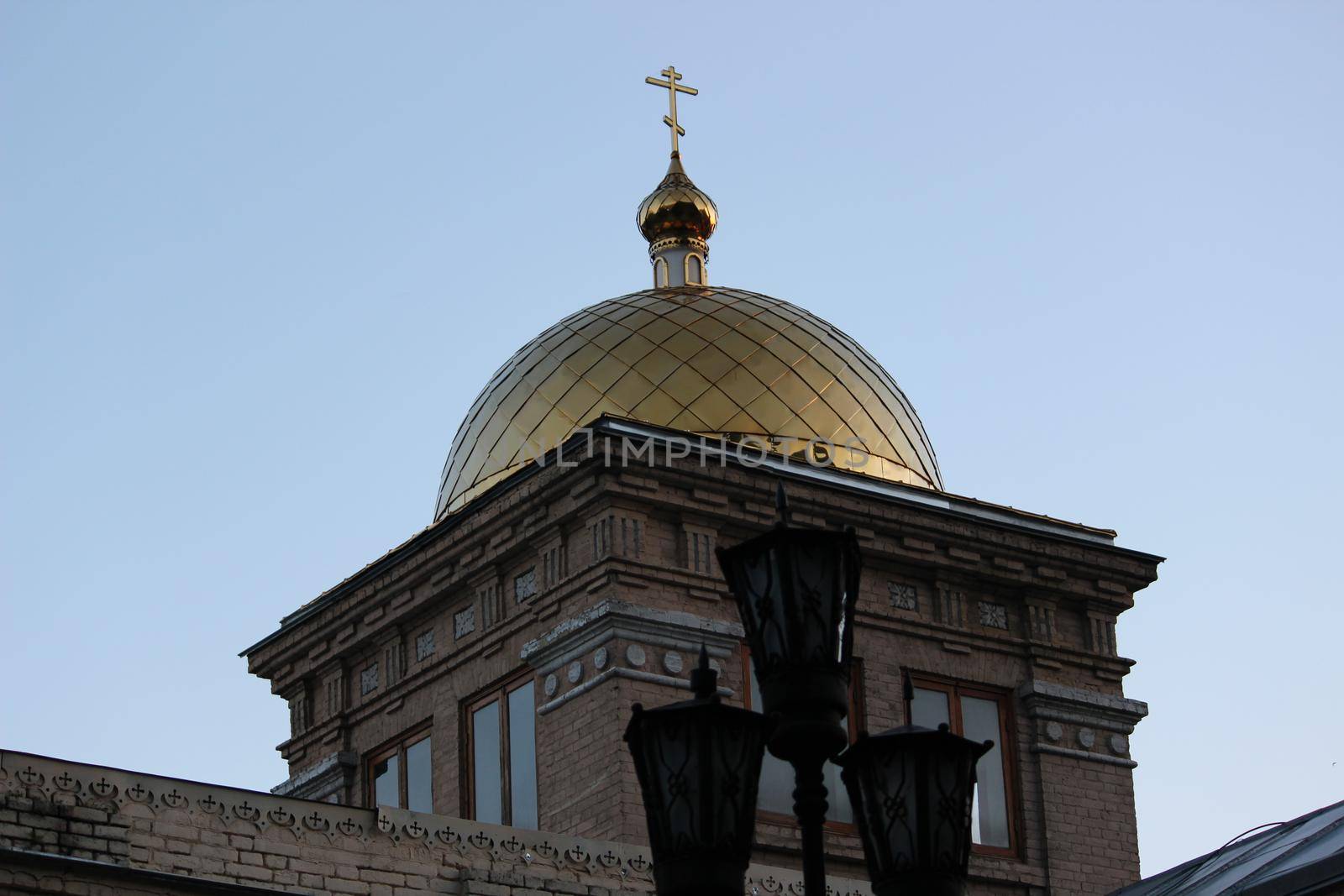 Orthodoxy. The golden domes of the Christian temple against the blue sky.