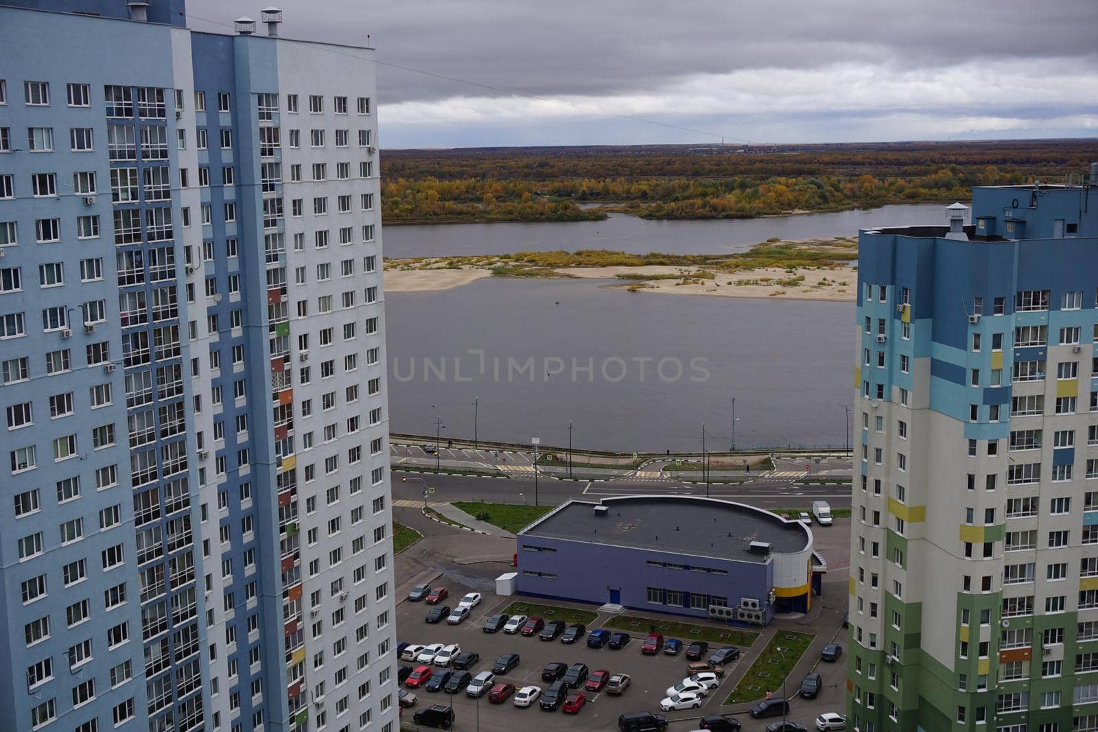 Metropolis. Large apartment buildings in the city by the river.