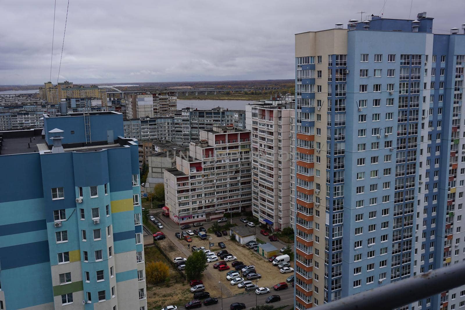 Metropolis. Large apartment buildings in the city by the river.