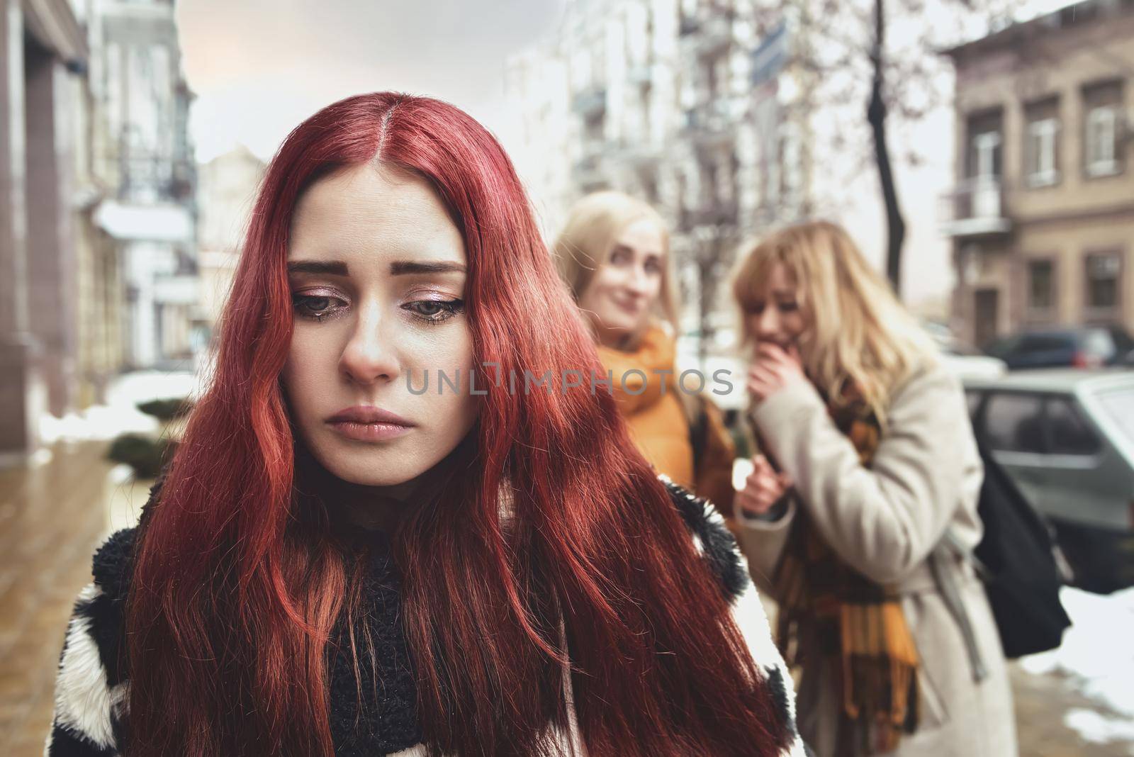 a young depressed student girl with red hair who is bullied by her teenage peers, disturbed by feelings of despair and suffering from oppression. social problems