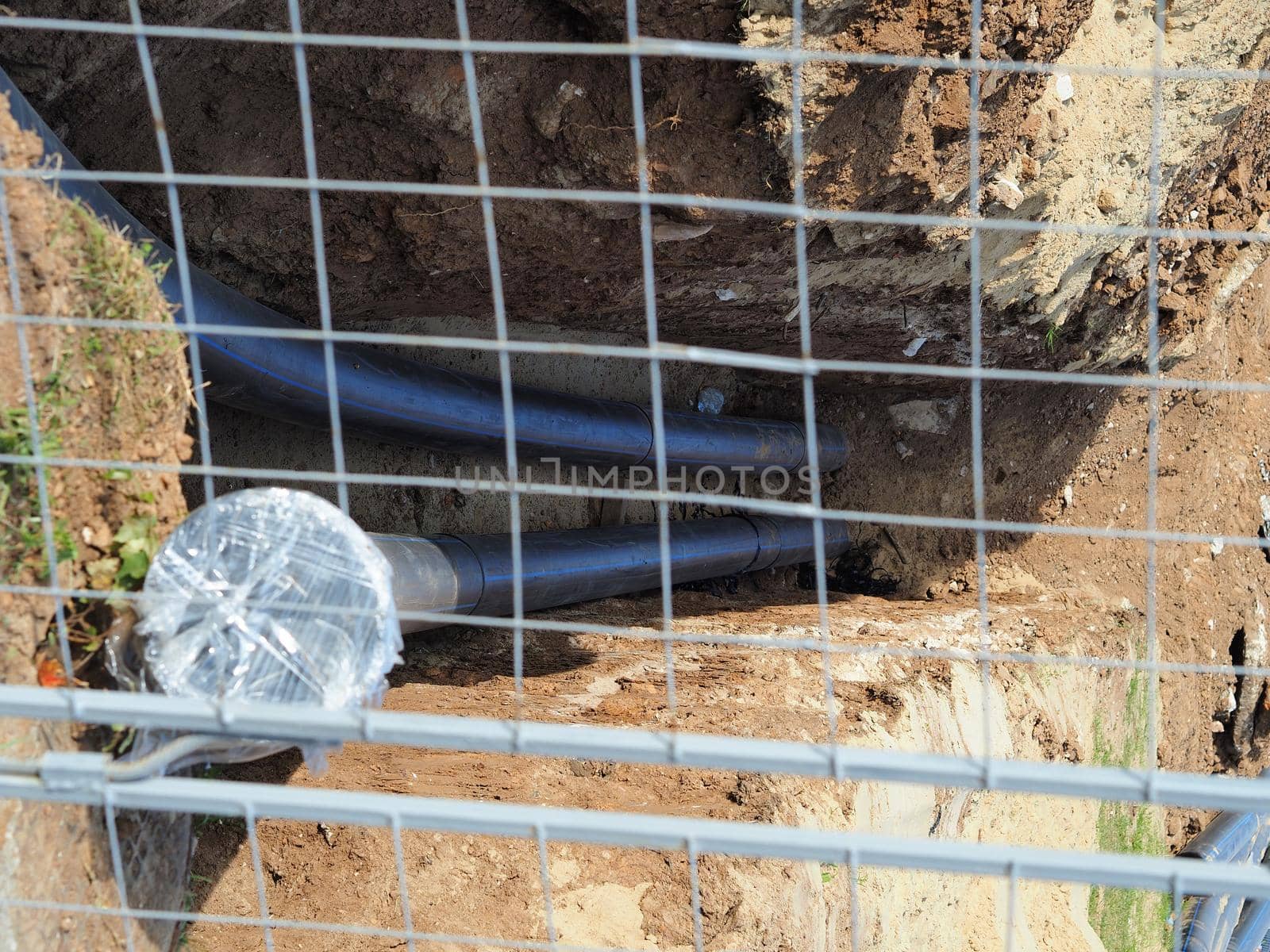 Water communications pipes are laid in the ground.