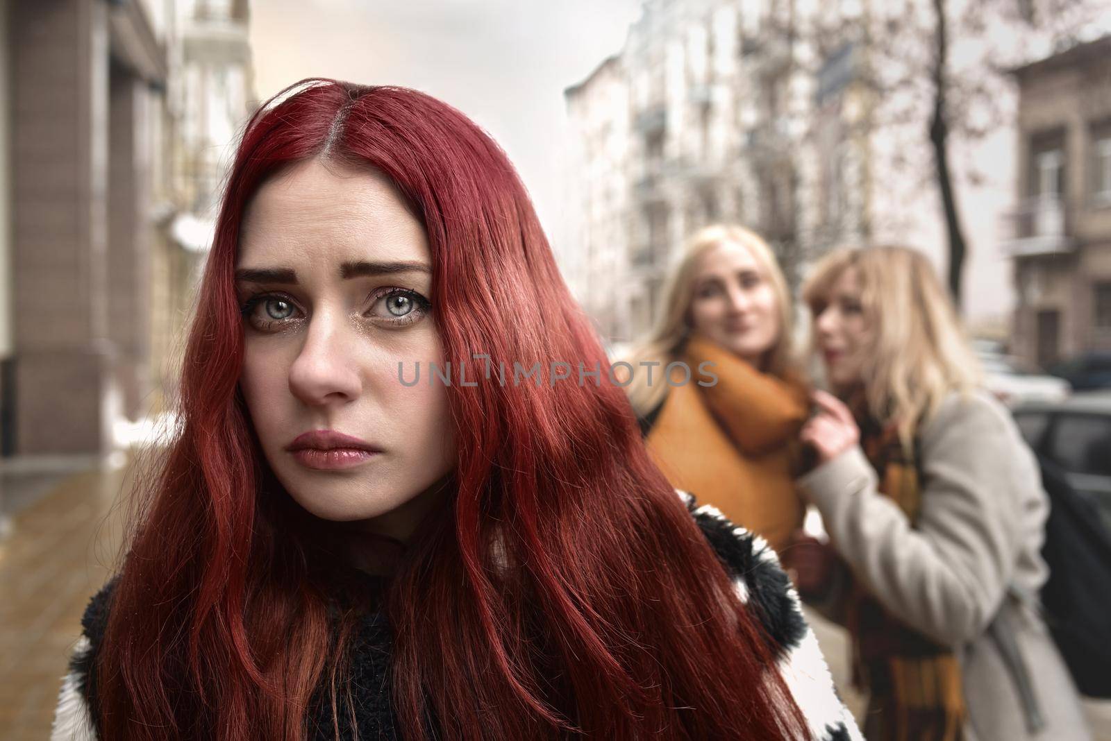 a young depressed student girl with red hair who is bullied by her teenage peers, disturbed by feelings of despair and suffering from oppression. social problems