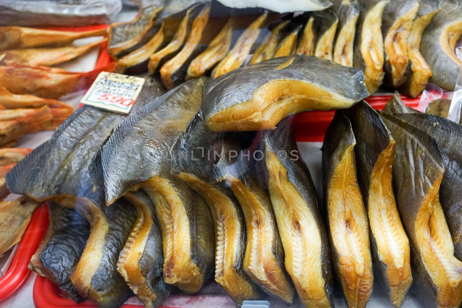 Smoked halibut on the counter of the store. Street trading