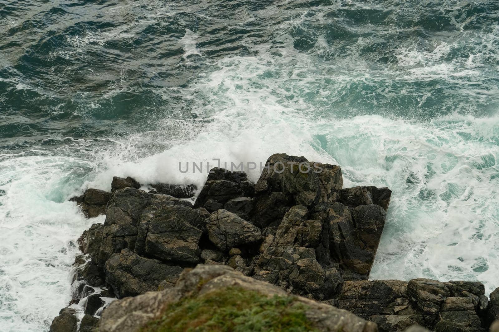 Seascape with waves crashing on rocks