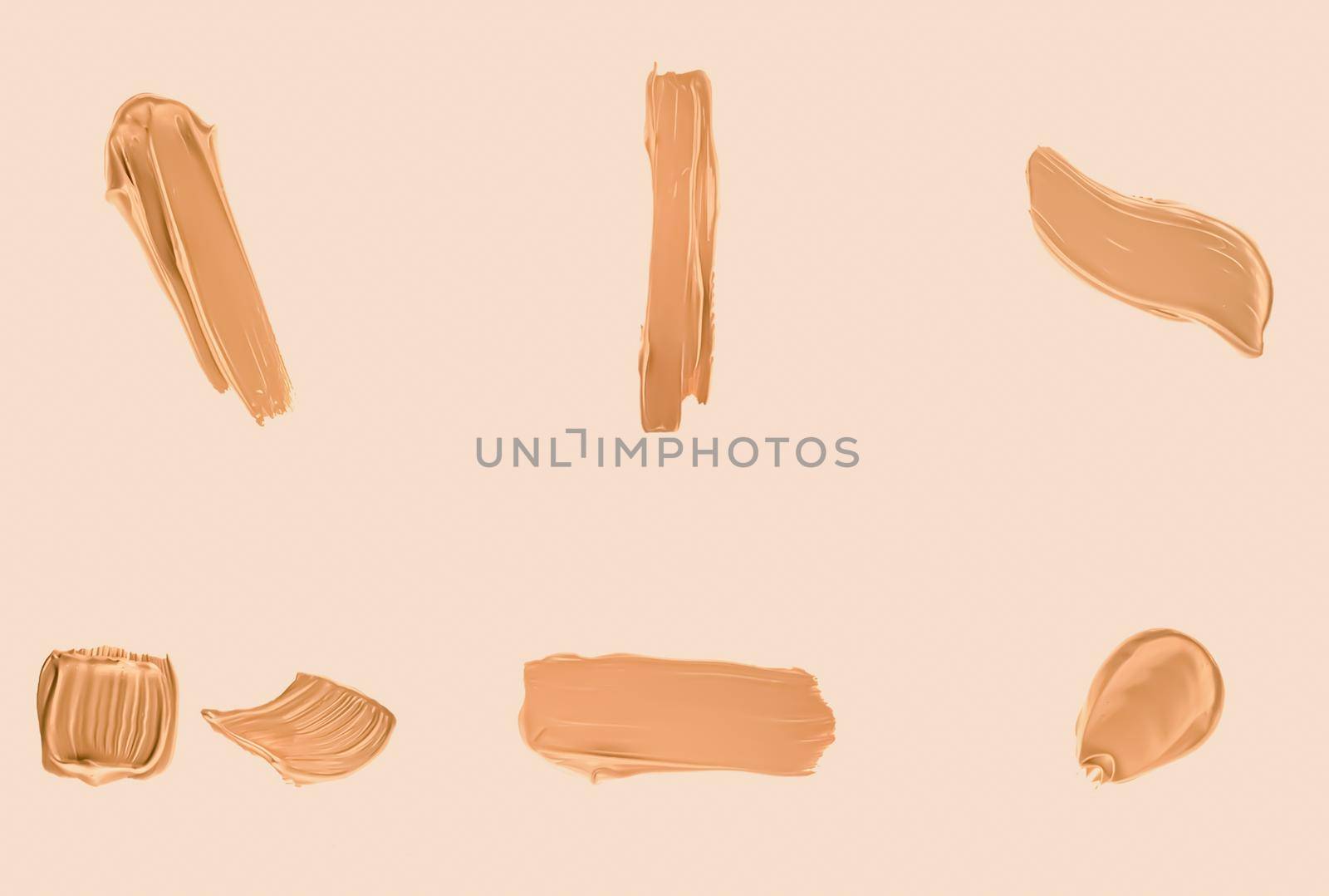 Liquid foundation smudges, smears and strokes as makeup textures isolated on beige background, beauty and cosmetics by Anneleven