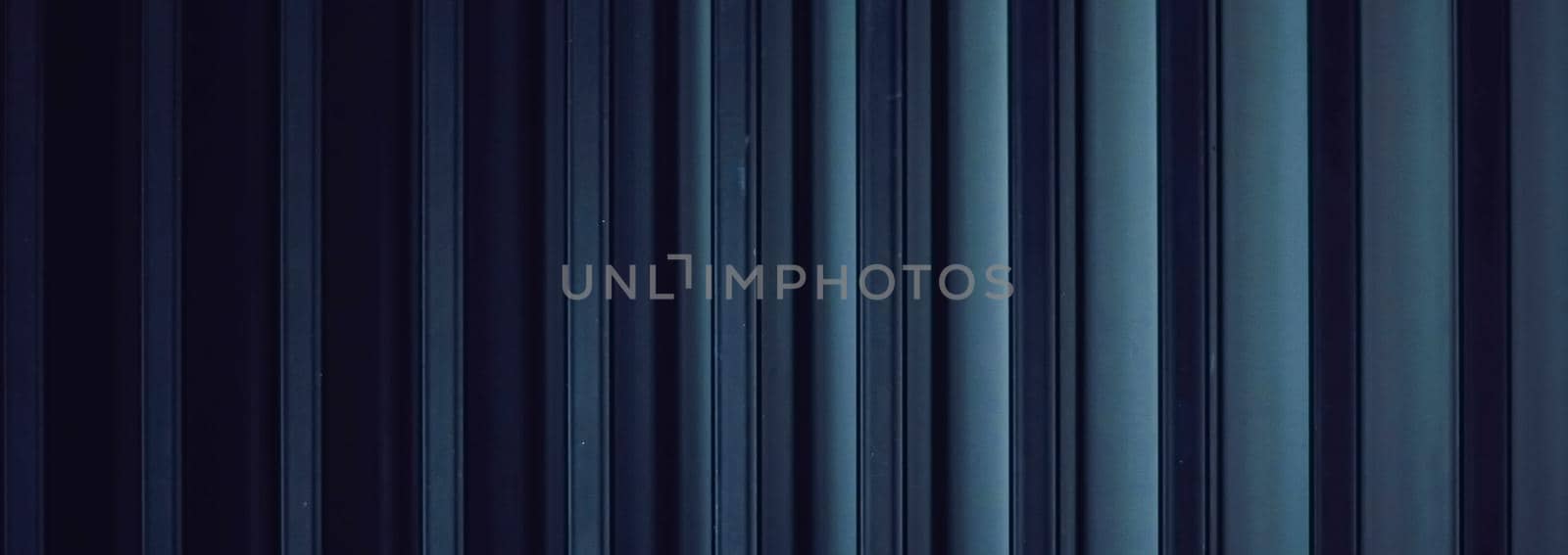 Dark blue metal background as industrial and futuristic urban backdrop by Anneleven