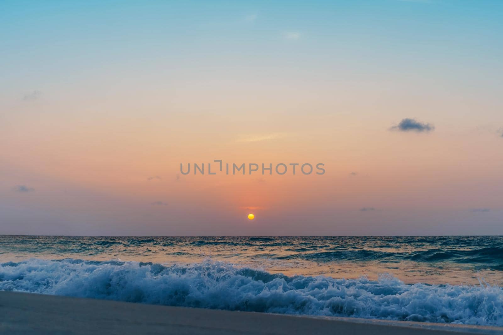 Colorful vibrant ocean sea wave beach summer with sunrise or sunset background landscape on vacation day. 