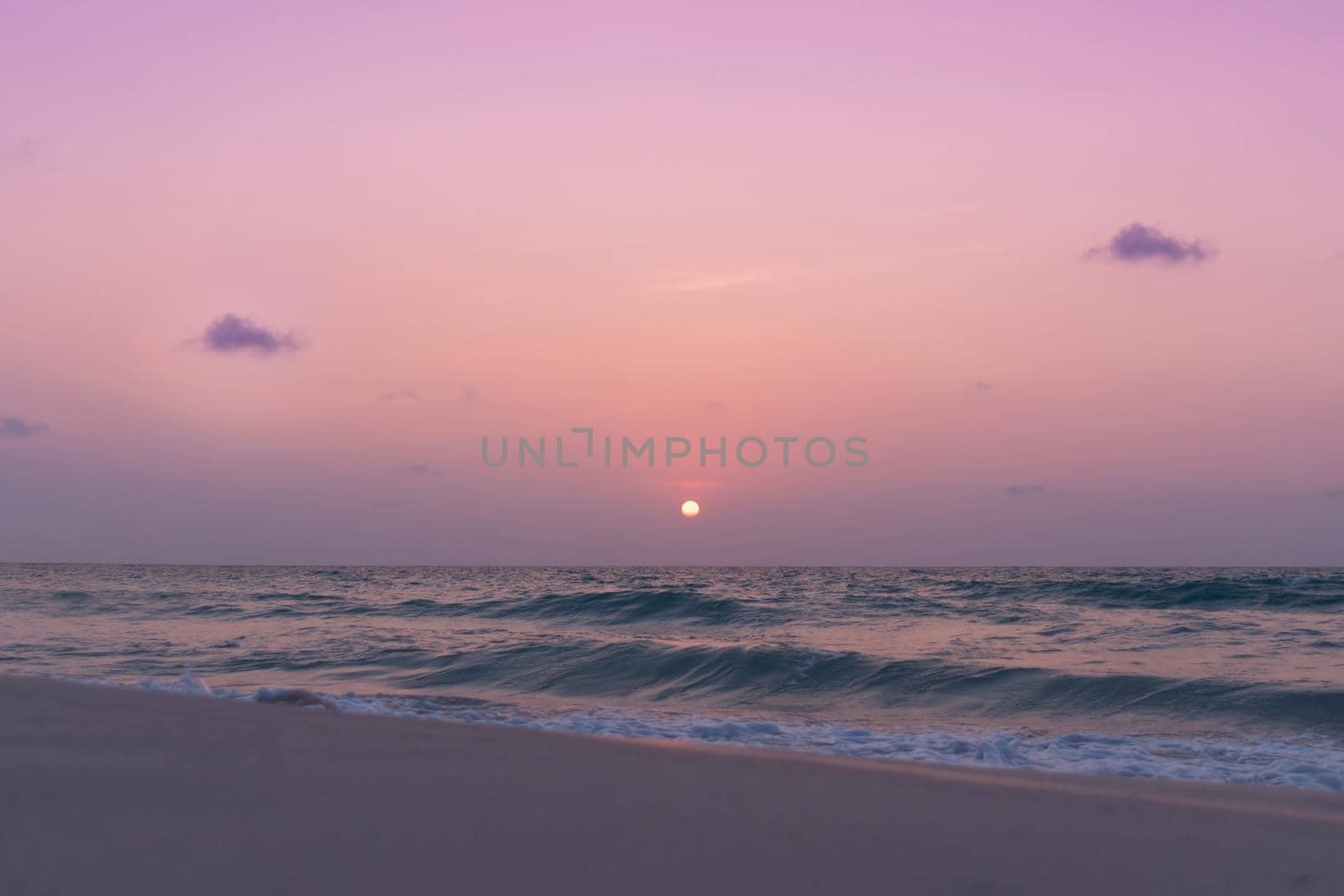 Colorful vibrant ocean sea wave beach summer with sunrise or sunset background landscape on vacation day. 