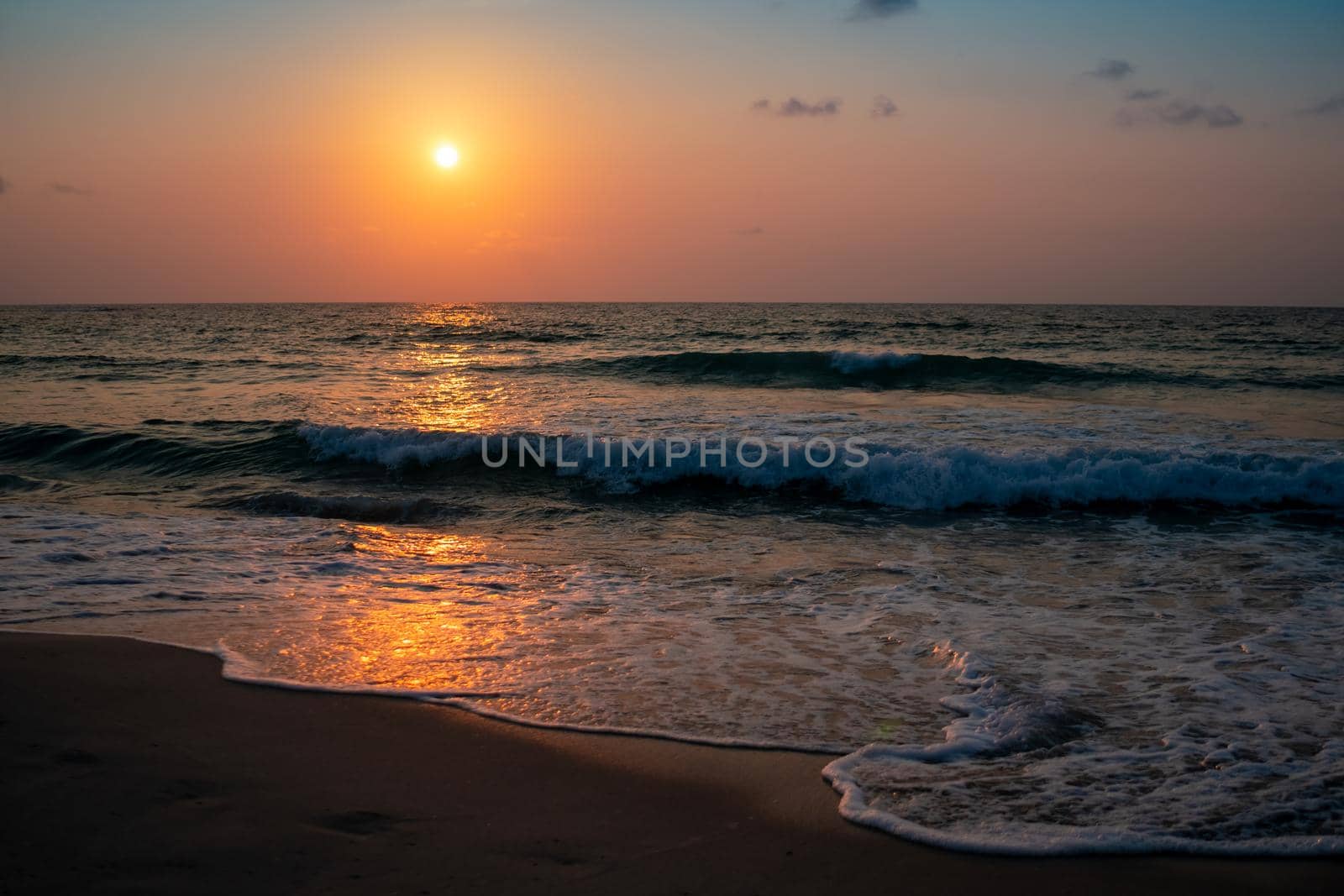 Colorful vibrant ocean sea wave beach summer with sunrise or sunset background landscape on vacation day. 