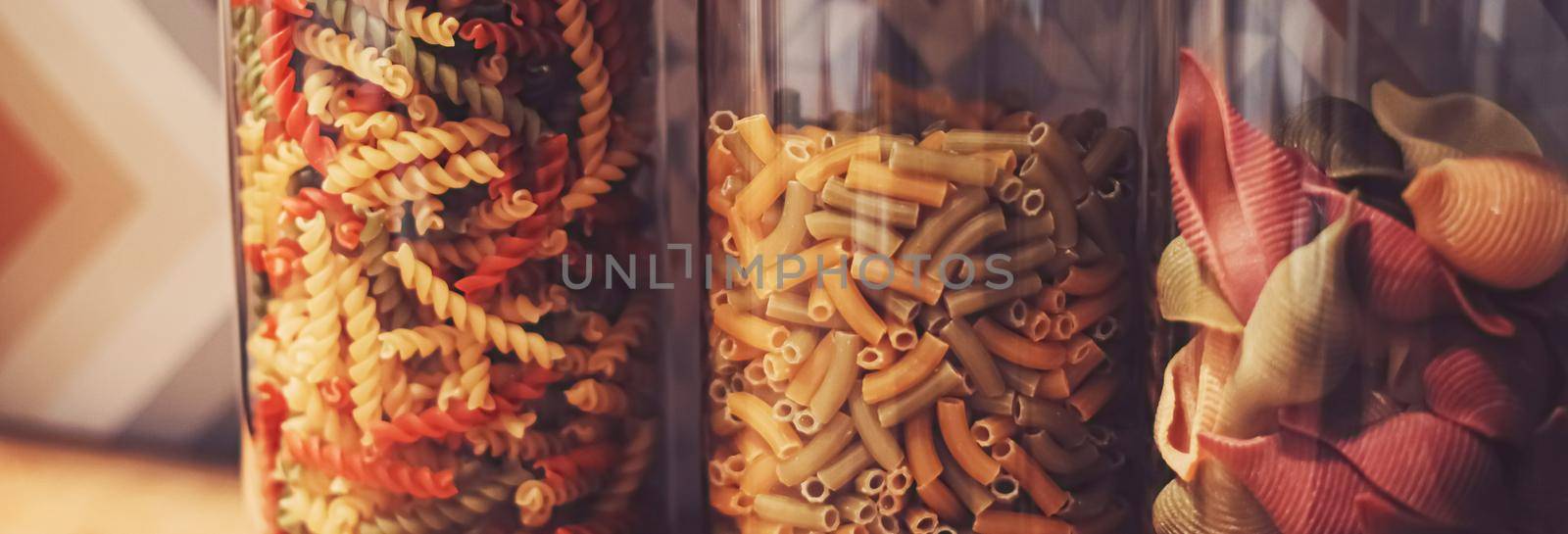 Pasta in dry food storage containers in the kitchen, pantry organisation and home decor by Anneleven