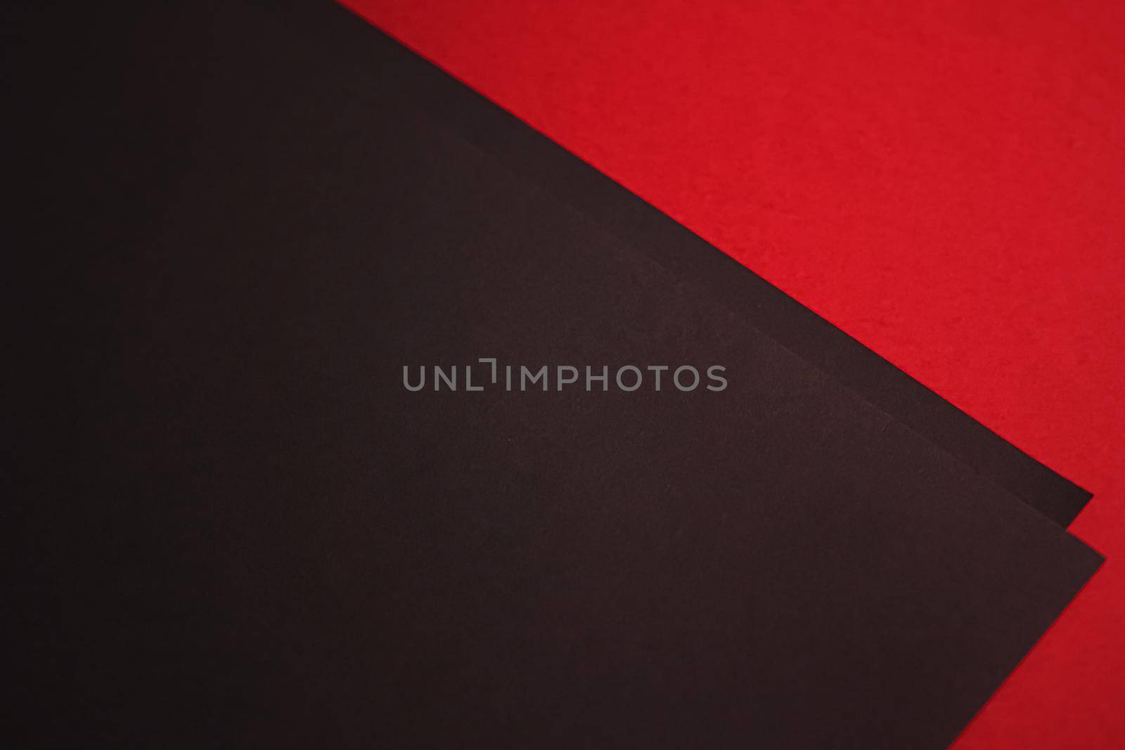 Black A4 papers on red background as office stationery flatlay, luxury branding flat lay and brand identity design for mockups