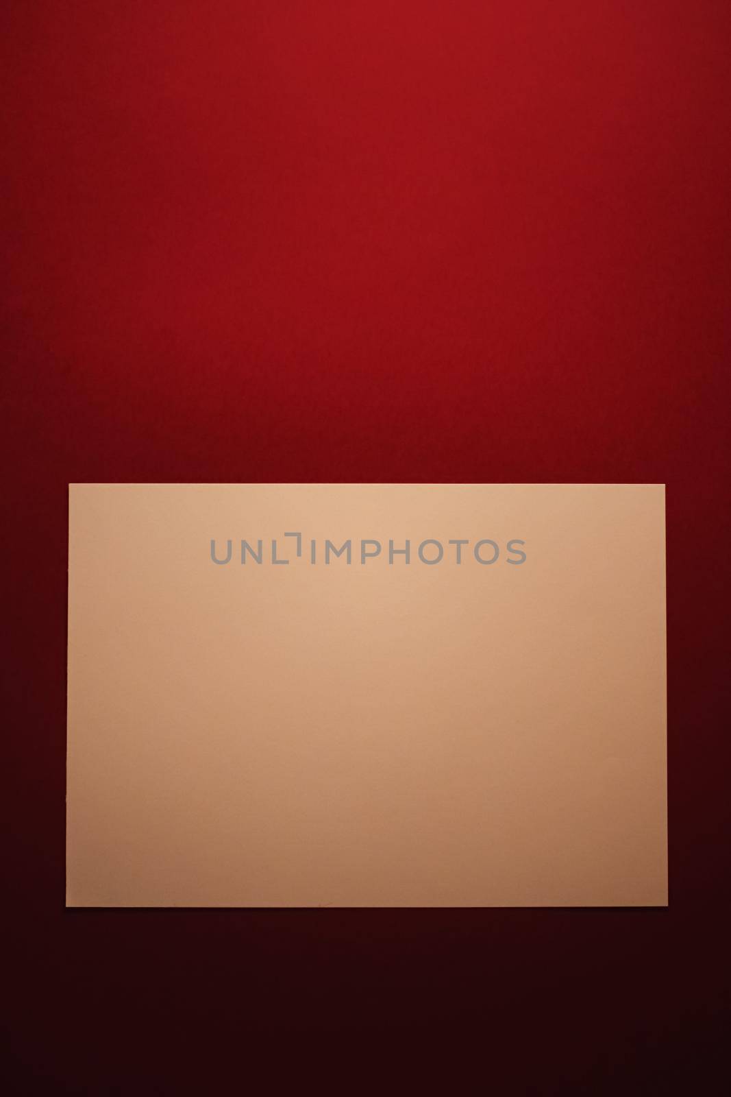 Beige A4 paper on dark red background as office stationery flatlay, luxury branding flat lay and brand identity design for mockups