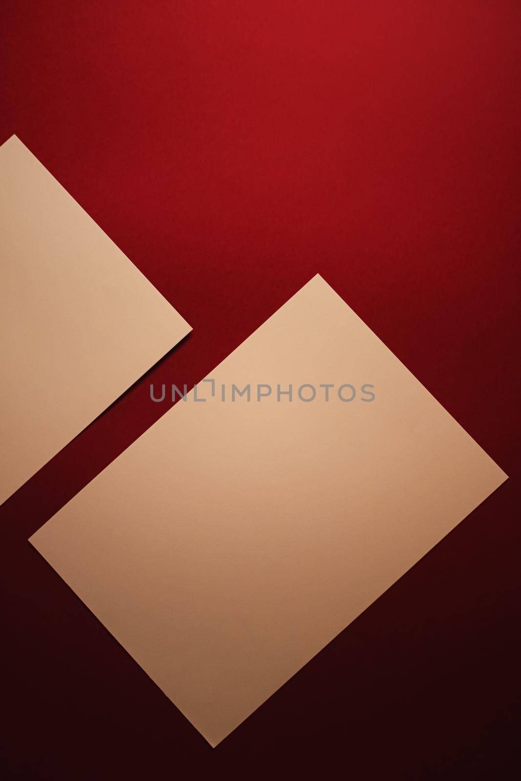 Beige A4 papers on dark red background as office stationery flatlay, luxury branding flat lay and brand identity design for mockups