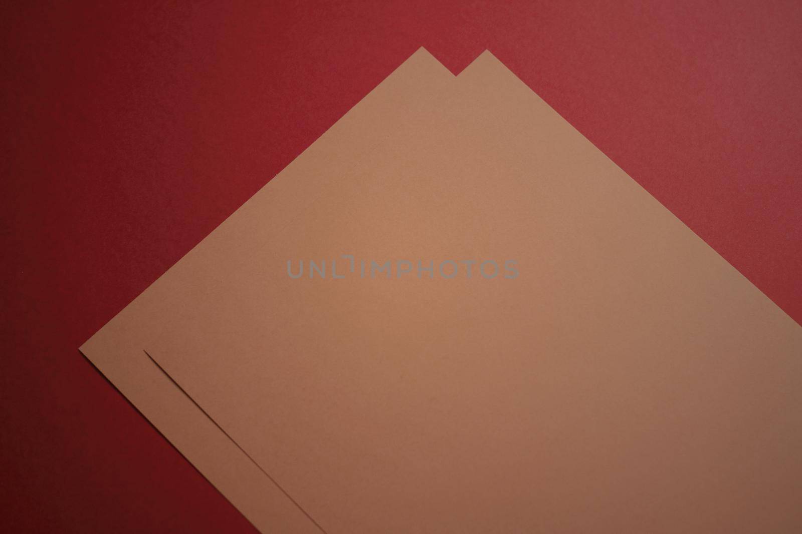 Beige A4 papers on red background as office stationery flatlay, luxury branding flat lay and brand identity design for mockups