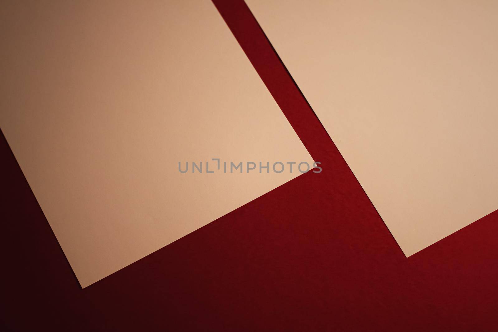 Beige A4 papers on dark red background as office stationery flatlay, luxury branding flat lay and brand identity design for mockups