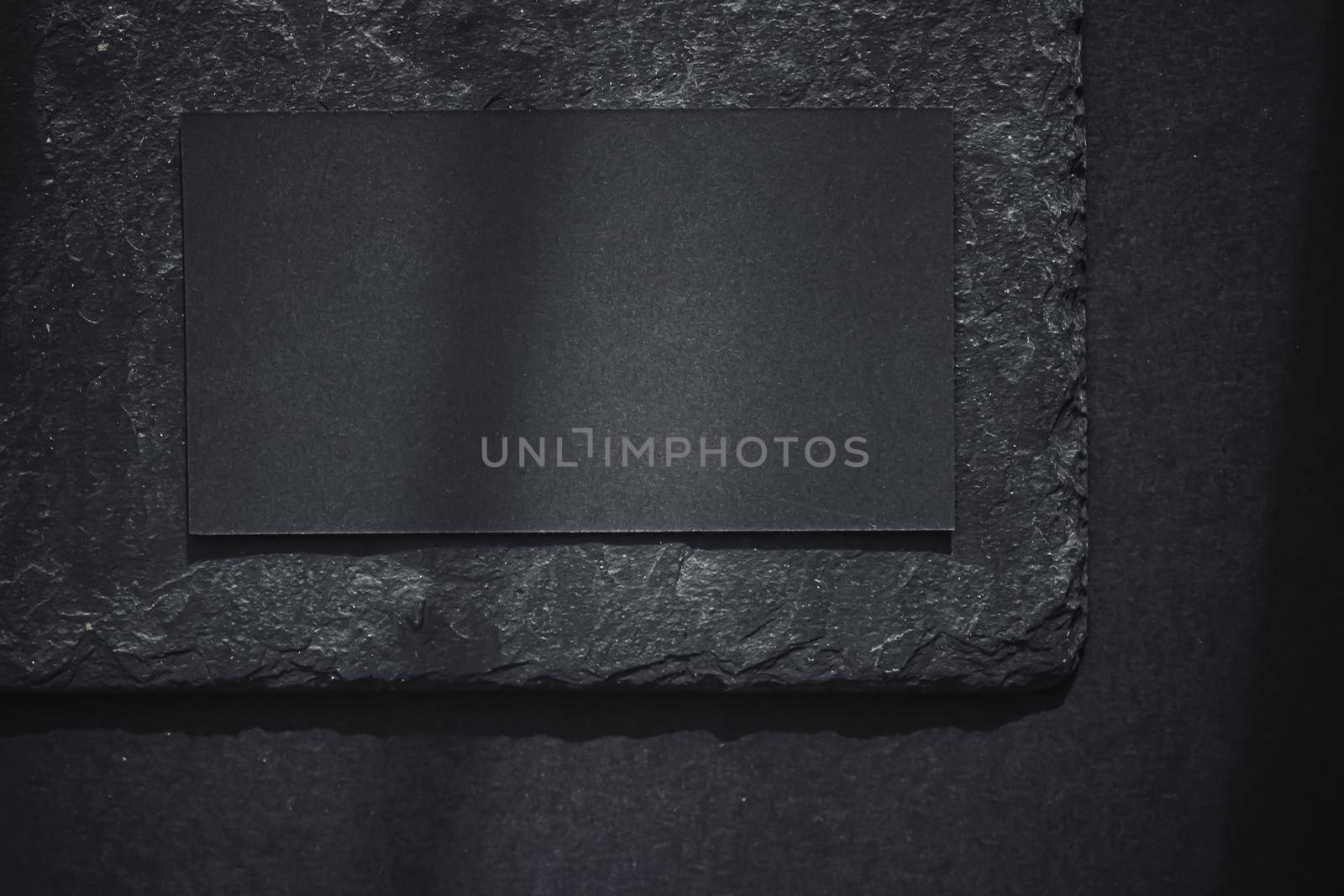 Black business card on dark stone flatlay background and sunlight shadows, luxury branding flat lay and brand identity design for mockup by Anneleven