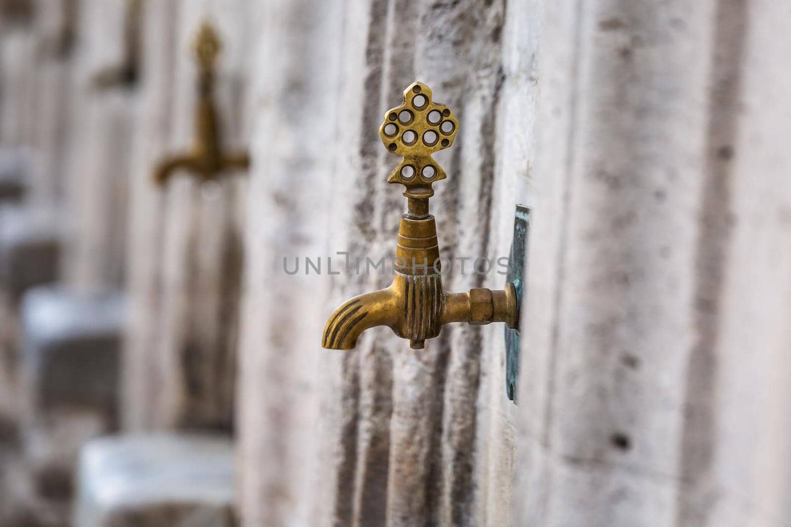 Water tap for washing hands and feet before the prayer in ablution faucets in the Suleymaniye Mosque, Istanbul, Turkey.