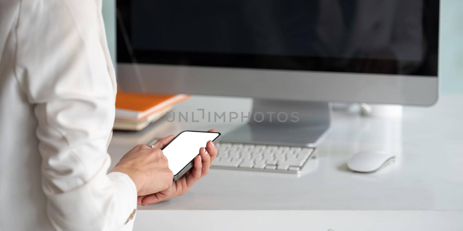 Close up woman use of smart phone at office