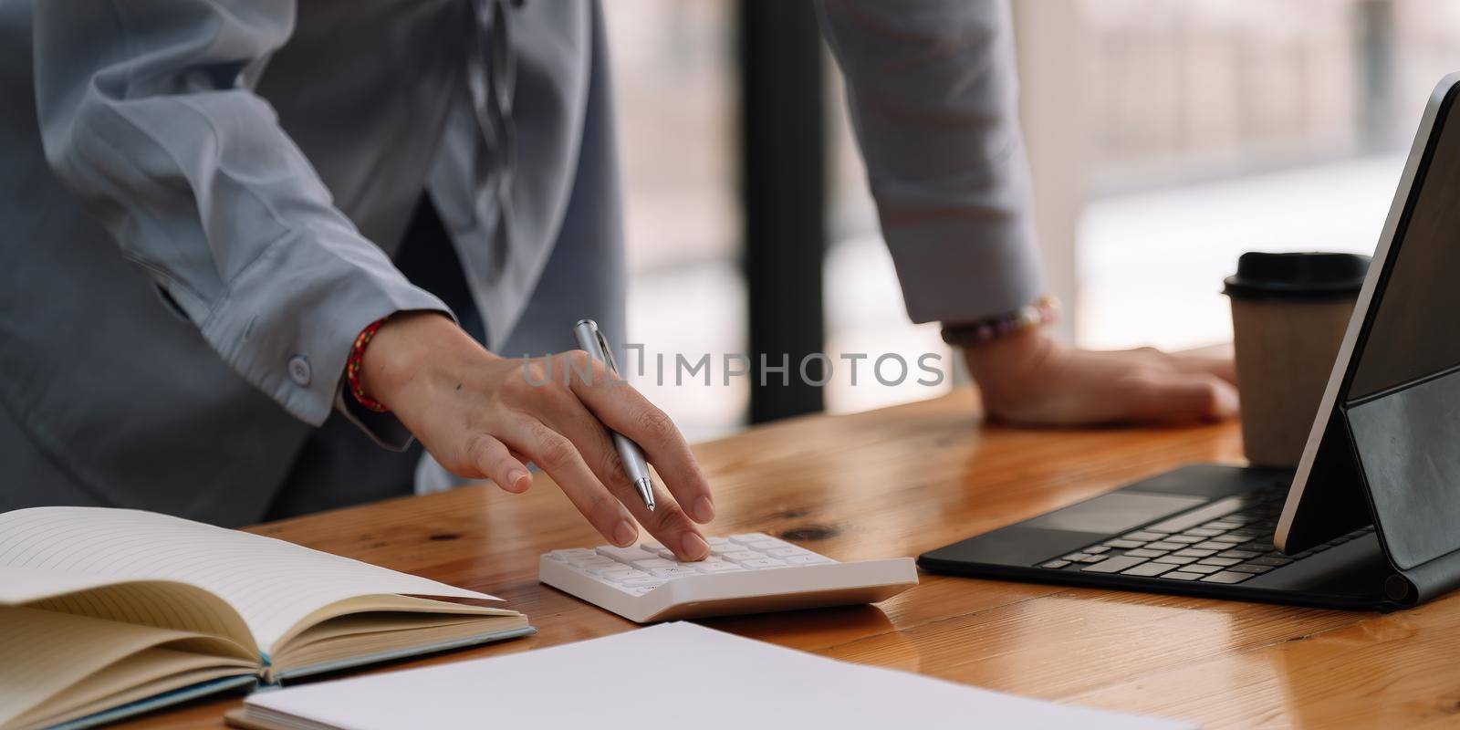 Close up of businesswoman accountant or banker making calculations.Business Financing Accounting Banking Concept