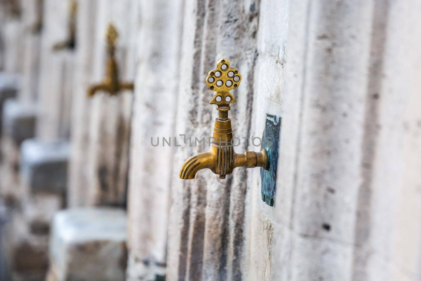 Water tap for washing hands and feet before the prayer in ablution faucets in the Suleymaniye Mosque, Istanbul, Turkey.