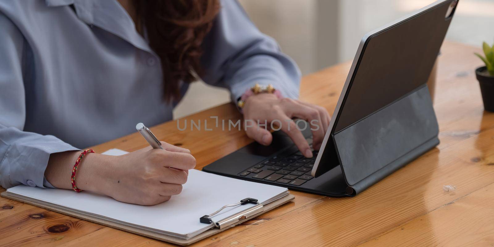 Close up woman having educational course online, using digital tablet in cafe, student studying online concept by nateemee