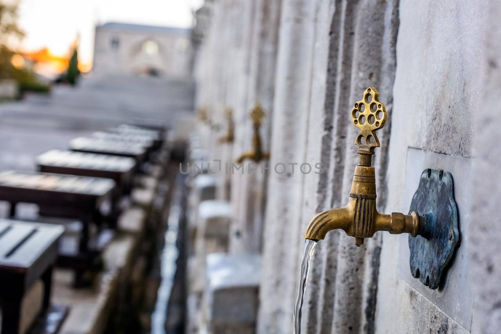 Water tap for washing hands and feet before the prayer in ablution faucets in the Suleymaniye Mosque, Istanbul, Turkey.