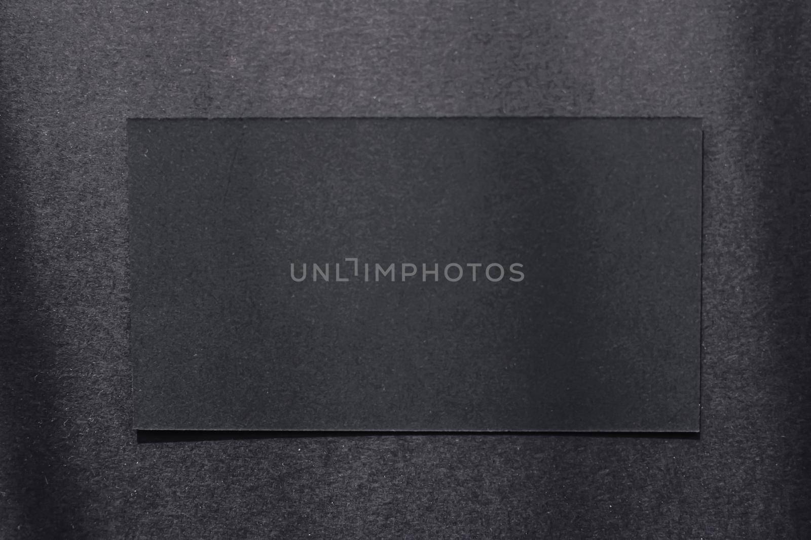 Black business card on dark flatlay background and sunlight shadows, luxury branding flat lay and brand identity design for mockup by Anneleven