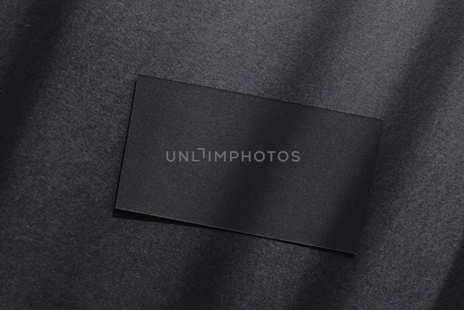 Black business card on dark flatlay background and sunlight shadows, luxury branding flat lay and brand identity design for mockup by Anneleven