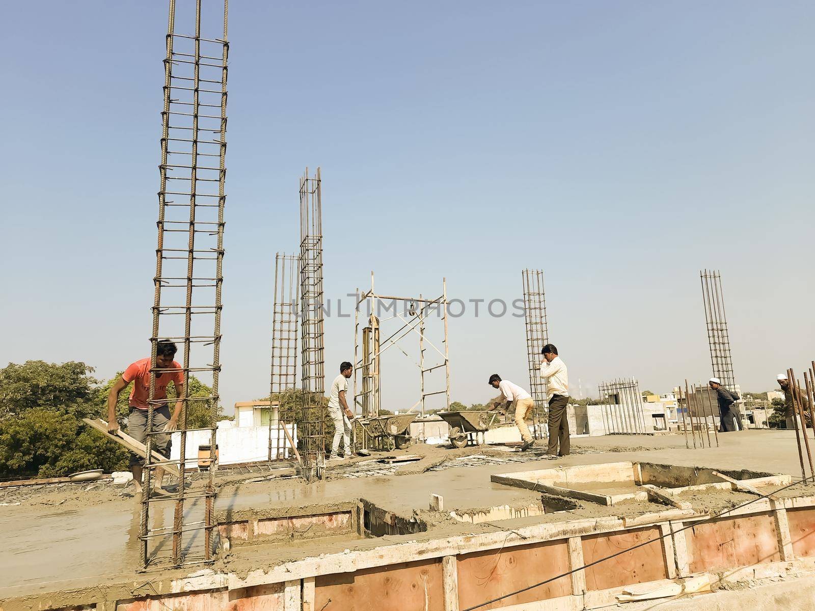 pouring concrete slab - concrete pouring during commercial concreting floors of buildings in construction by tabishere