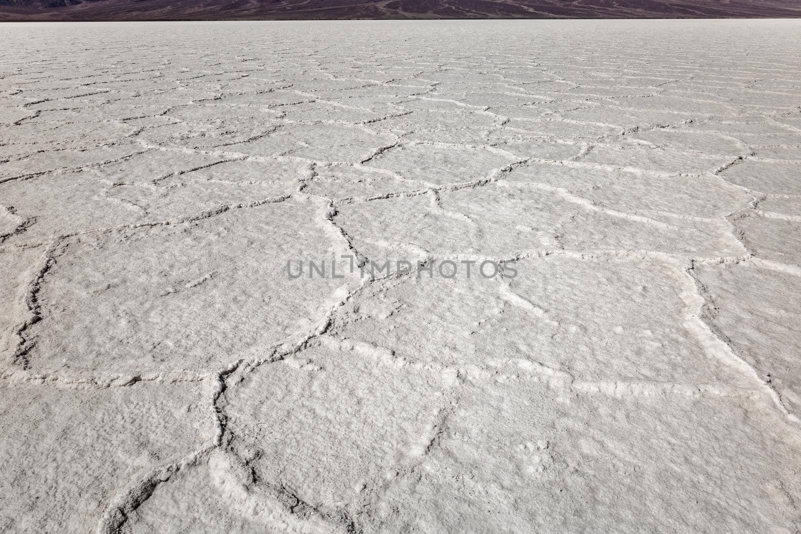 Death Valley salt flats near the badwater area of the national park. The crusted salt rises to the desert surface and bakes in the sun.