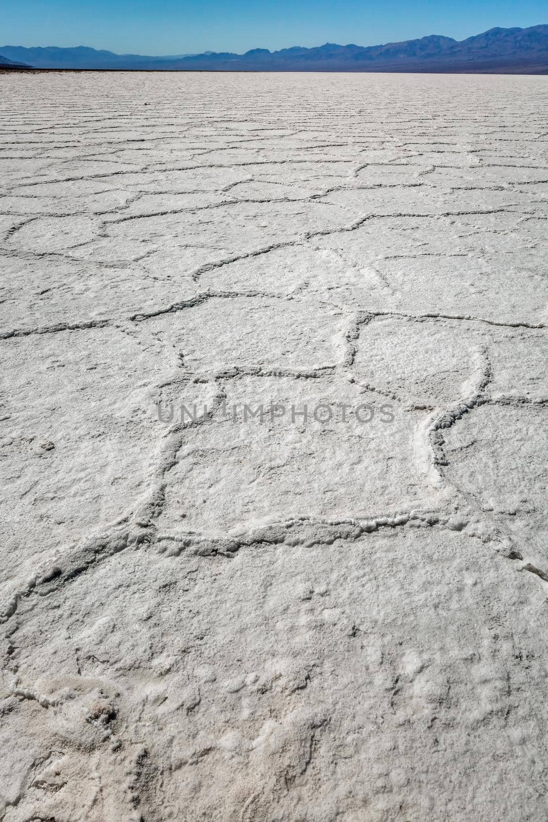 Death Valley salt flats near the badwater area of the national park. The crusted salt rises to the desert surface and bakes in the sun.
