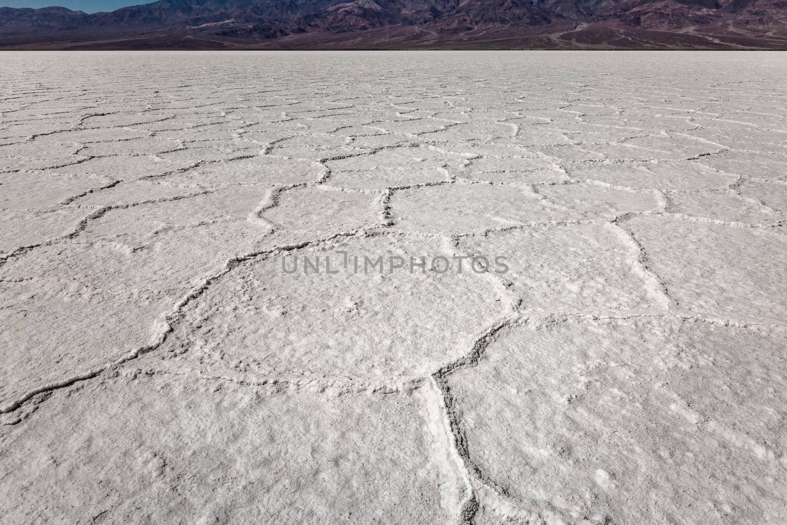 Death Valley salt flats near the badwater area of the national park. The crusted salt rises to the desert surface and bakes in the sun.