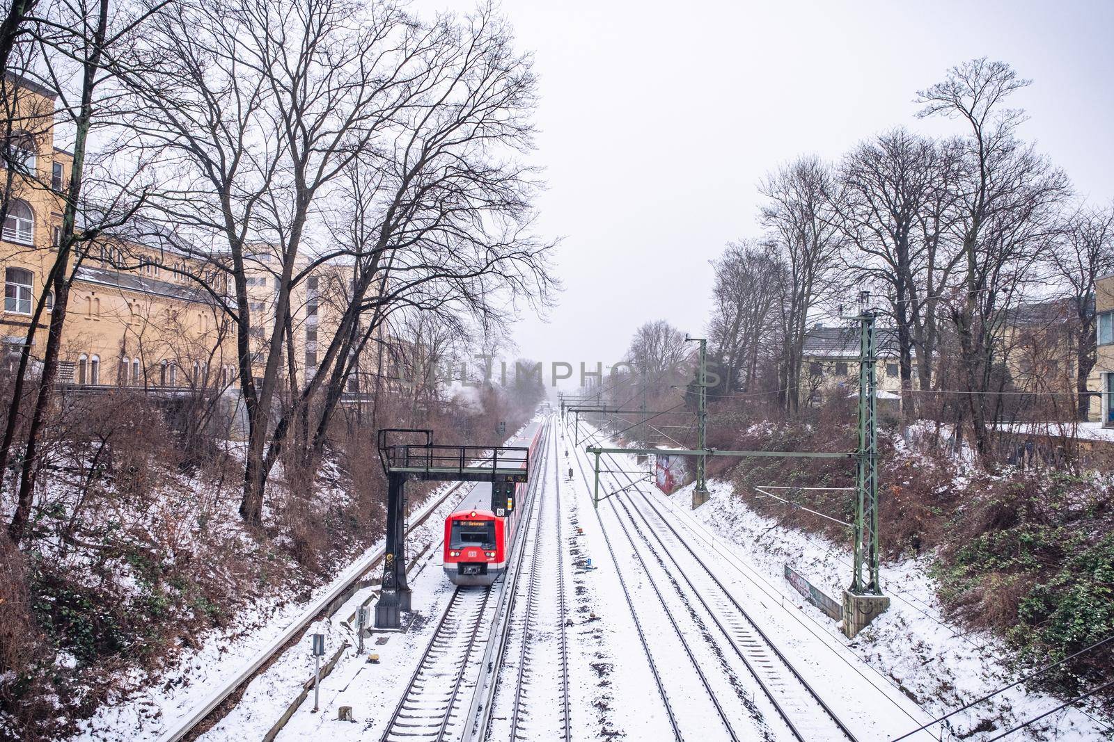 View of the rails in the snow from the bridge in Hamburg in winter.