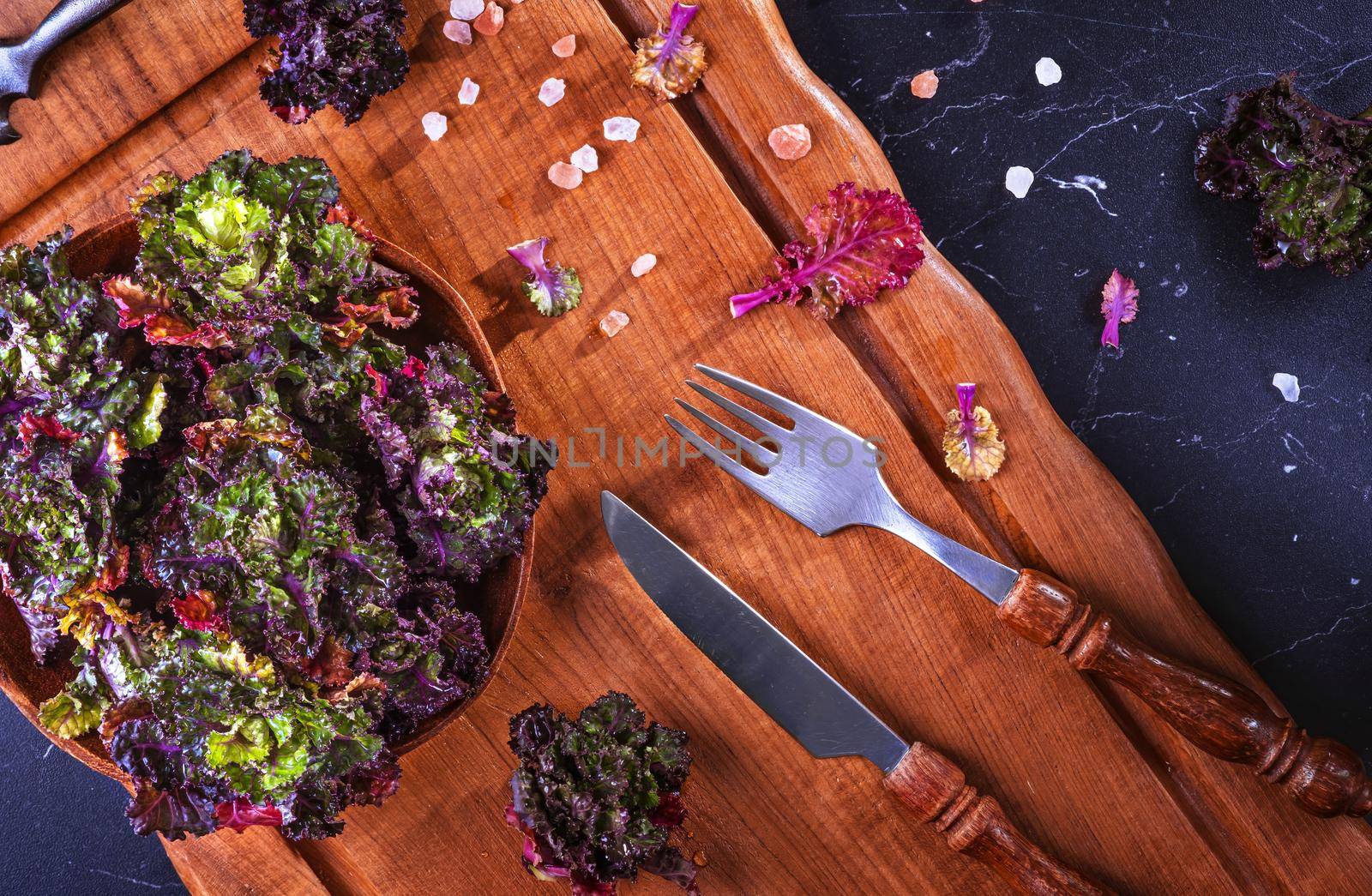 Fresh, healthy, colourfull Kalettes flower sprout on a wooden background.