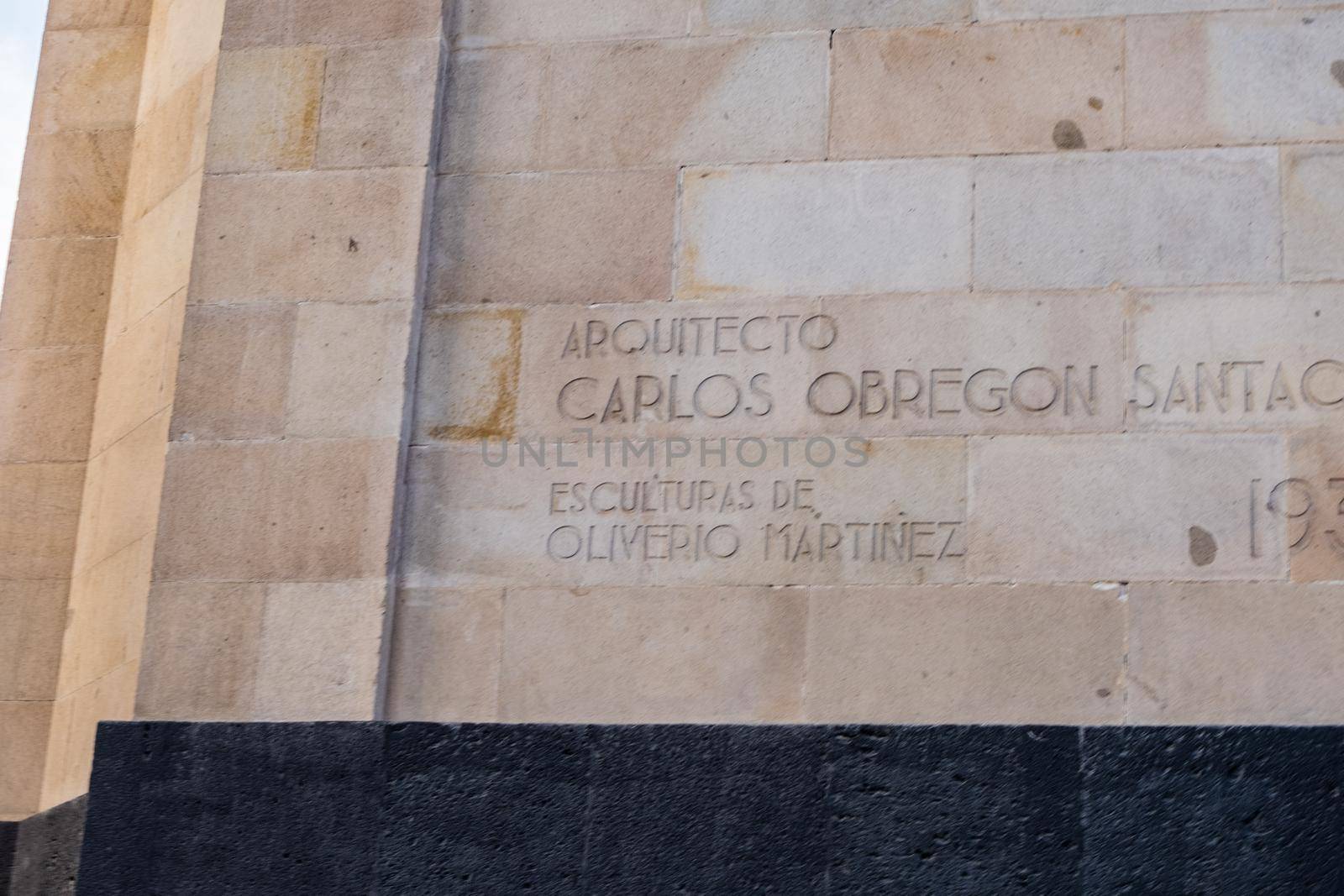 Commemorative plaque of the architect and sculptor on brick wall from the Monument to the Revolution. Names carved in column from majestic triumphal arch in Mexico City. Mexican landmarks