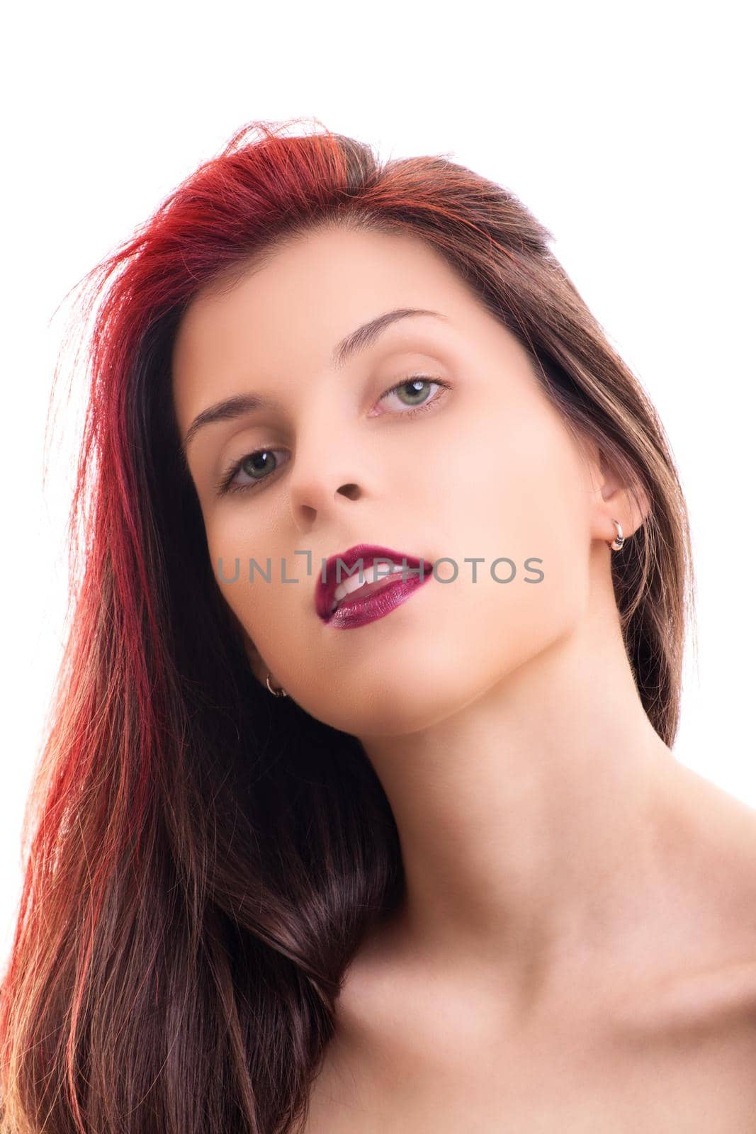 Sensual portrait of a beautiful redhead young woman with soft, clean make up and red lipstick, isolated on white background. Fashion and beauty concept.
