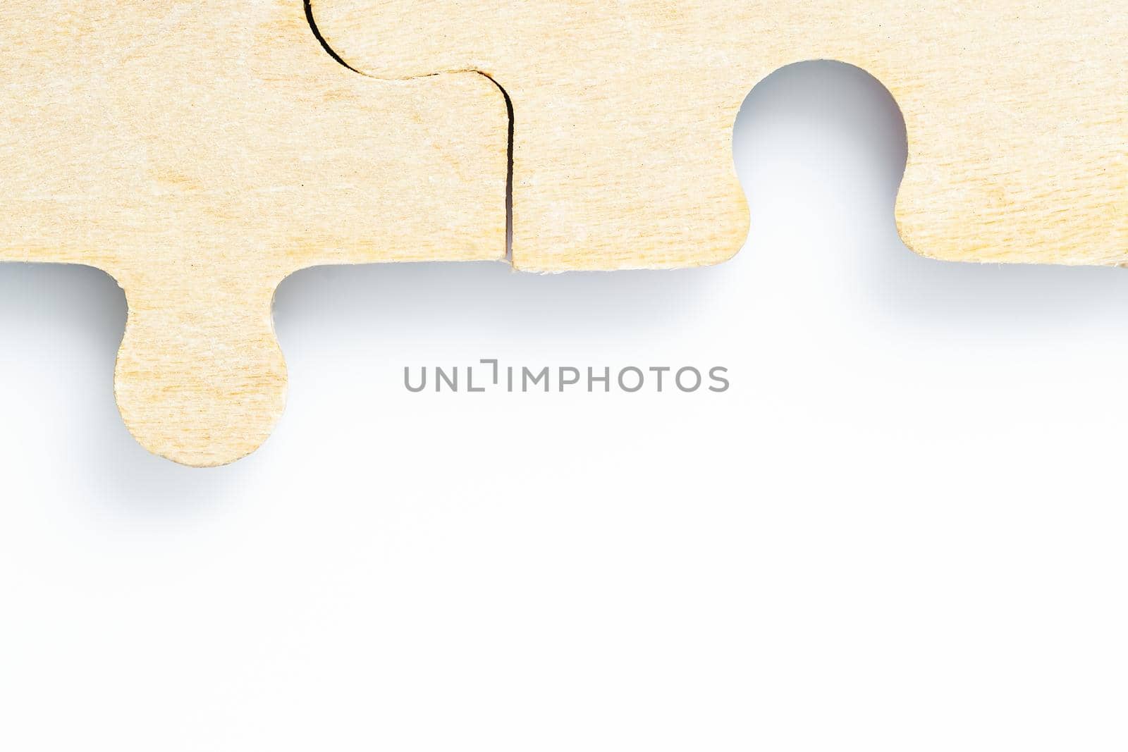 Close up shot of Missing jigsaw puzzle pieces on white background,business concept