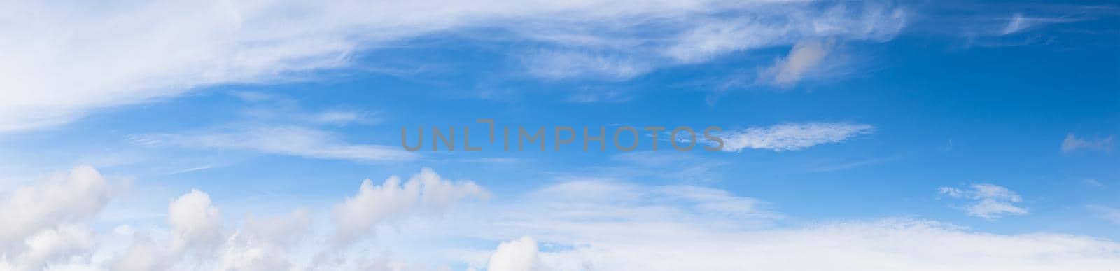 Panoramic blue sky with fluffy clouds  by stoonn