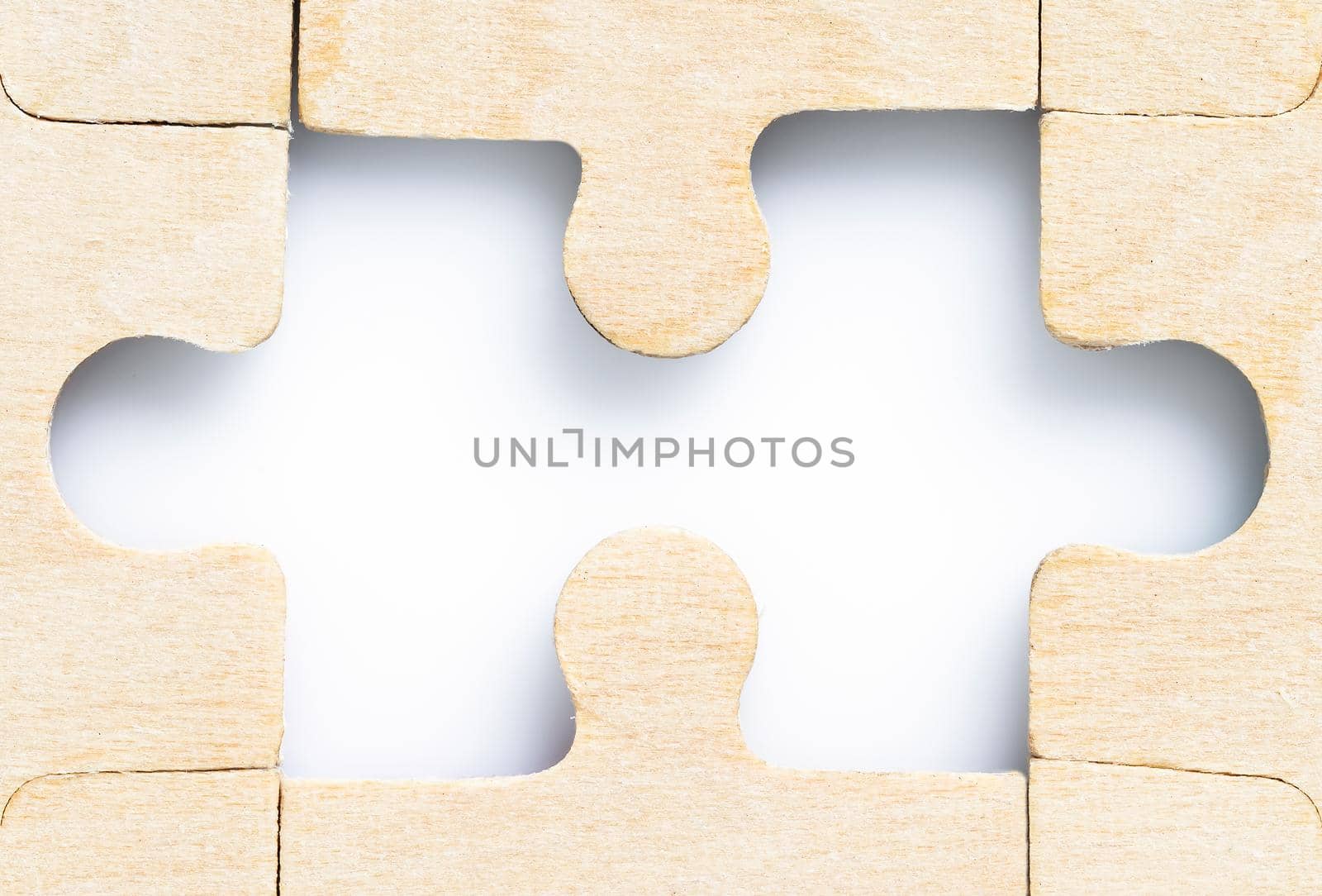 Close up shot of Missing jigsaw puzzle pieces on white background,business concept