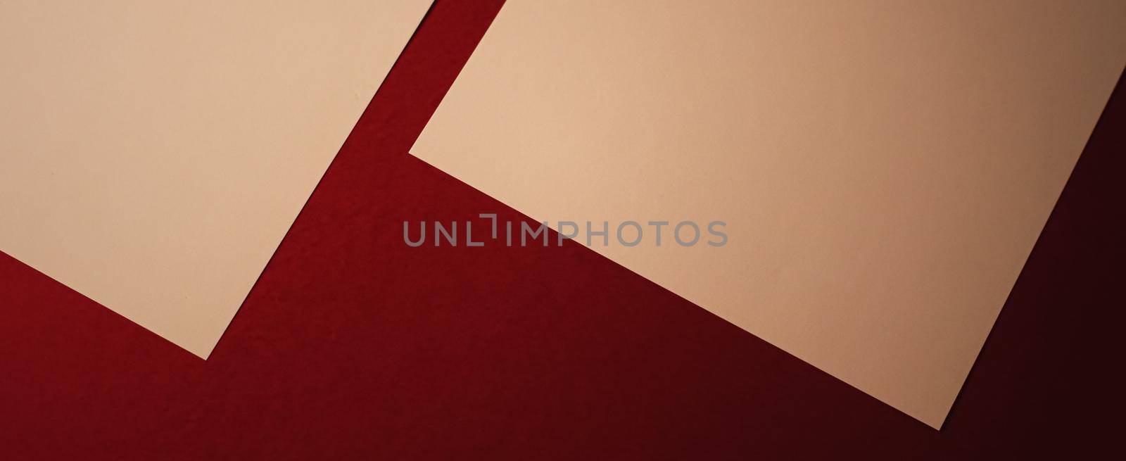 Beige A4 papers on dark red background as office stationery flatlay, luxury branding flat lay and brand identity design for mockup by Anneleven