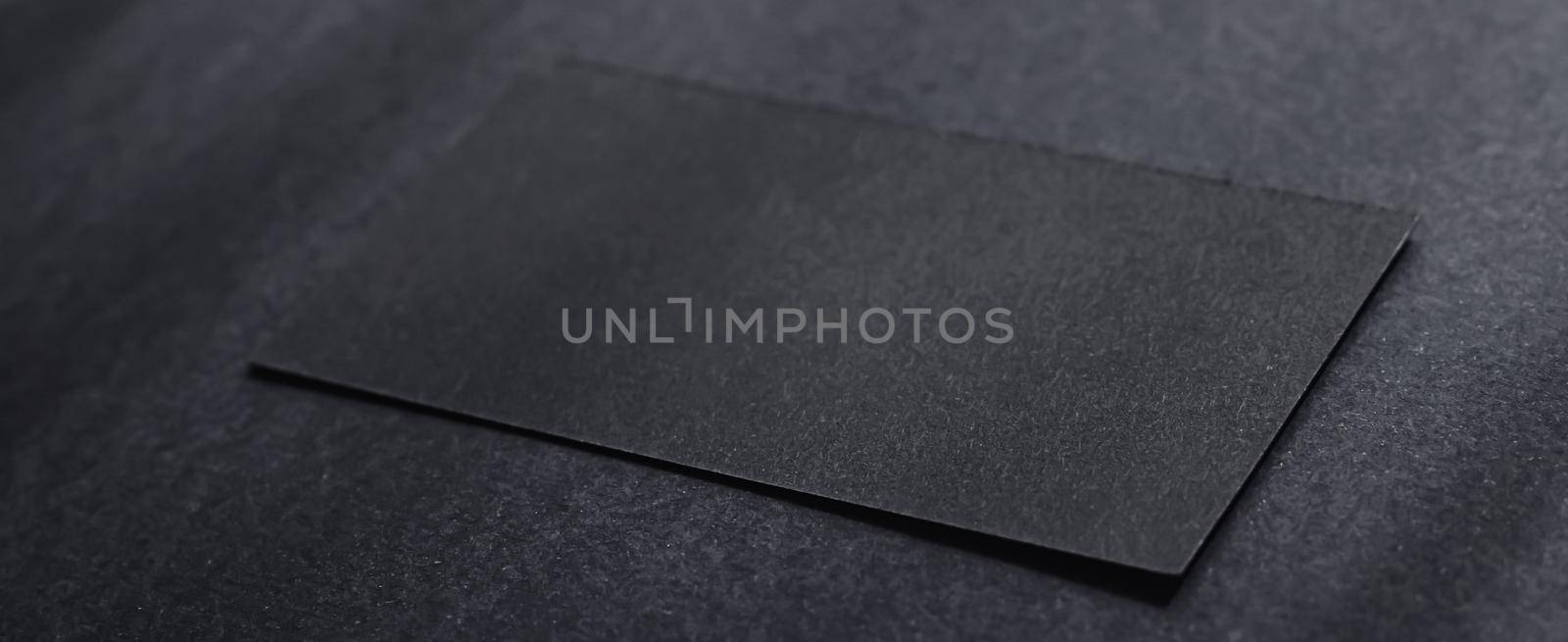 Black business card on dark flatlay background and sunlight shadows, luxury branding flat lay and brand identity design for mockup by Anneleven