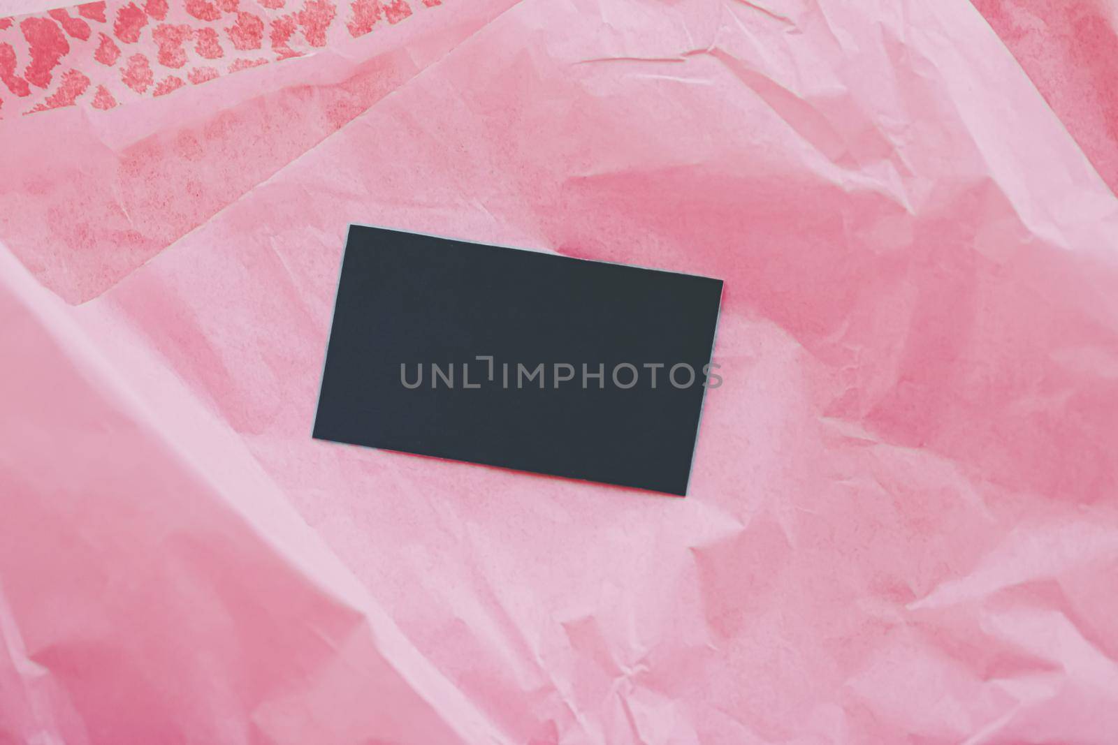 Black business card flatlay on pink tissue paper background, luxury branding flat lay and brand identity design for mockup by Anneleven
