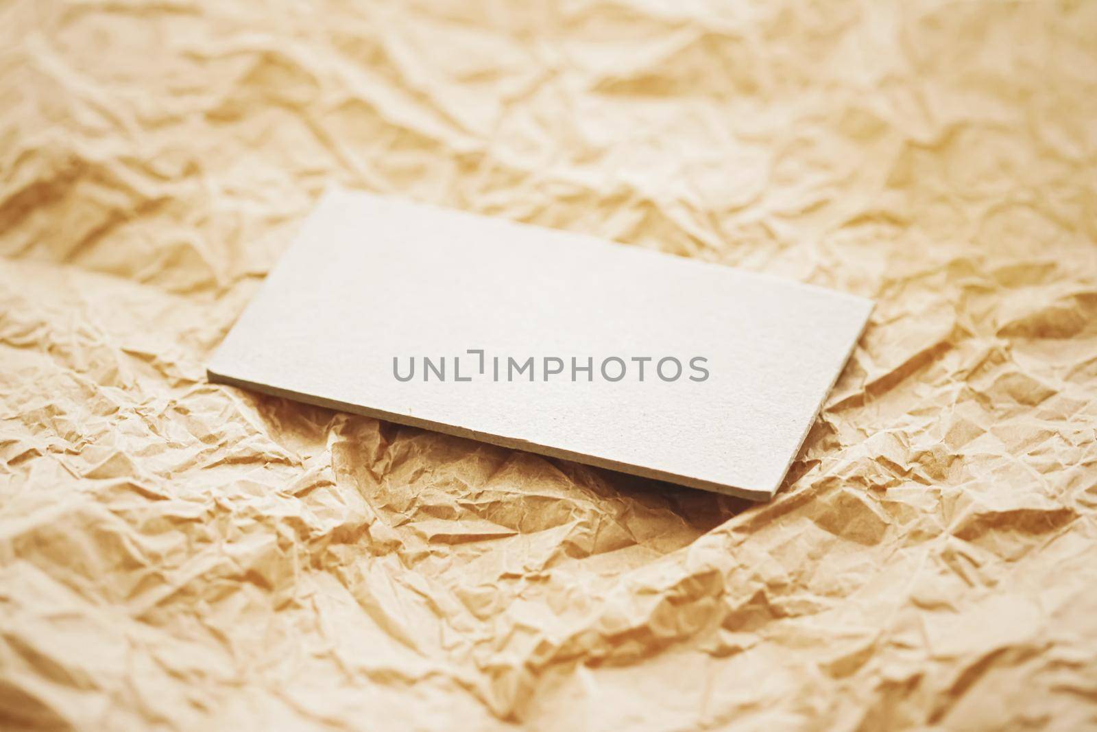 White business card flatlay on brown parchment paper background, luxury branding flat lay and brand identity design for mockups