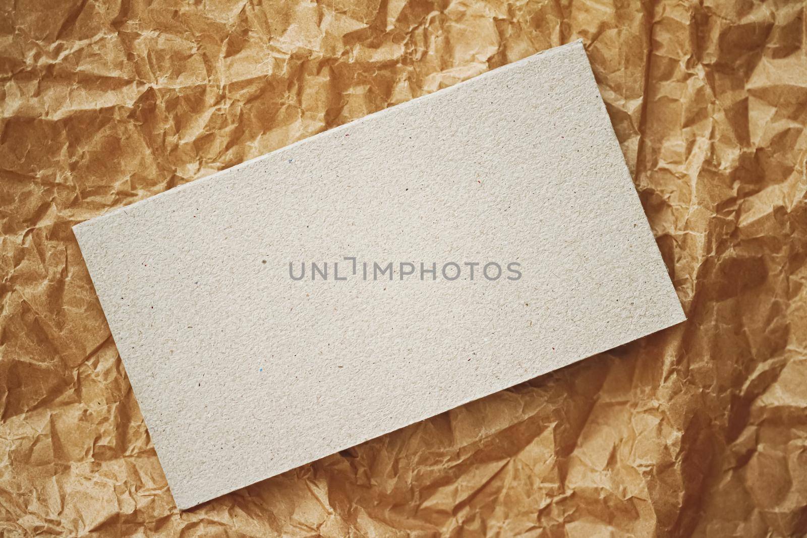 White business card flatlay on brown parchment paper background, luxury branding flat lay and brand identity design for mockups