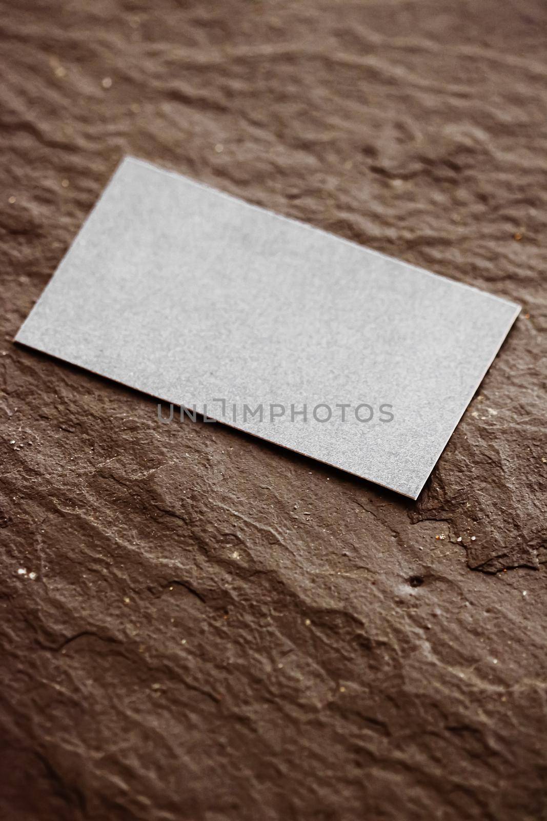 White business card flatlay on brown stone background, luxury branding flat lay and brand identity design for mockups