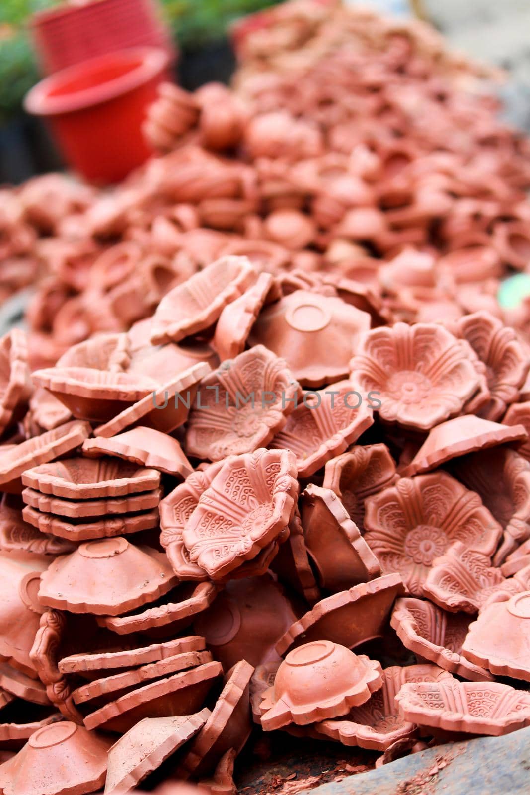 Vertical image of clay lamp (Diya) for sale at Market in india, diya decoration is part of Diwali Festival